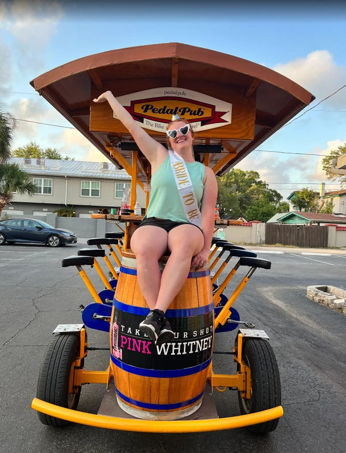bride with heart sunglasses and sash on pedalpub bike