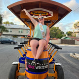 bride with heart sunglasses and sash on pedalpub bike