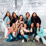 pedalpub st pete bachelorette group in front of mural 