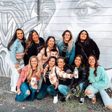 pedalpub st pete bachelorette group in front of mural 